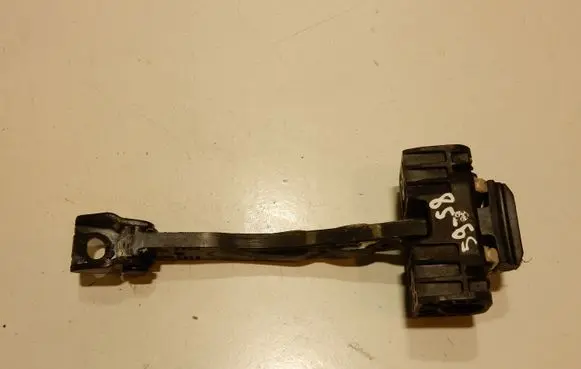 Front door check strap stopper