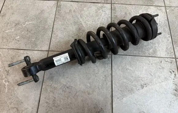 Front shock absorber with coil spring