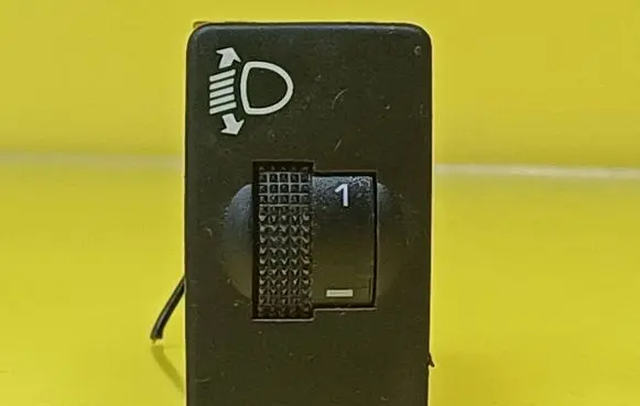 Headlight level height control switch