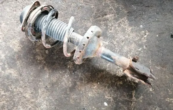 Subaru Outback Front shock absorber with coil spring