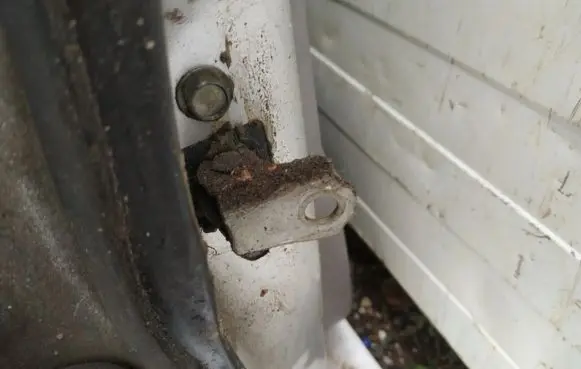 Front door check strap stopper