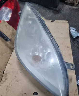 Mitsubishi Colt Headlight/headlamp MR957354 0301208202