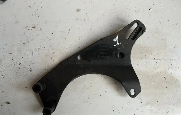 Volkswagen Golf III Power steering pump mounting bracket 037145544B