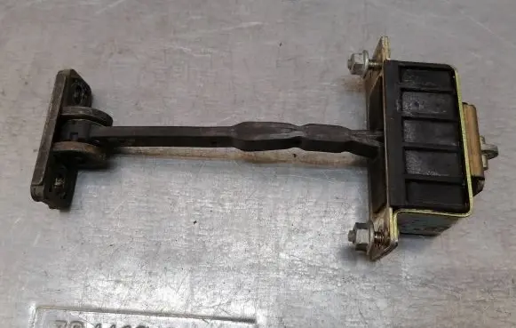 Front door check strap stopper