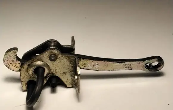 Front door check strap stopper