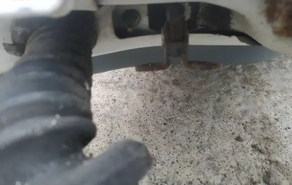Front door check strap stopper