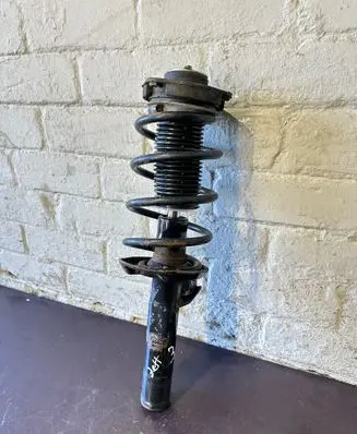 Volkswagen Jetta V Front shock absorber with coil spring 1T0413031Q