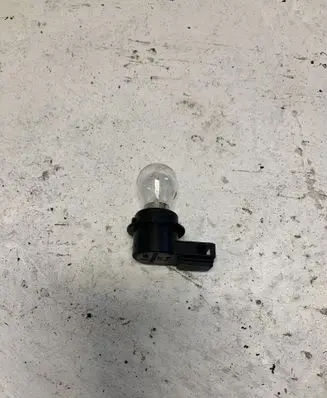 Tail light bulb cover holder
