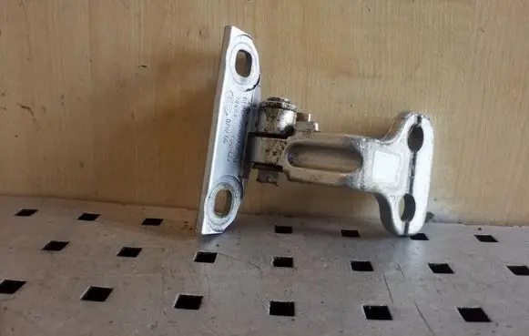 Rear door upper hinge