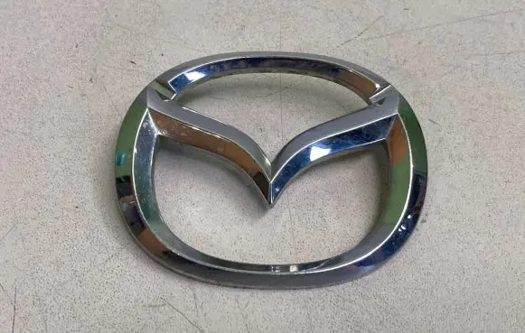 Mazda 323 F Manufacturers badge/model letters 