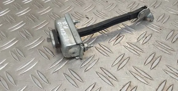 Front door check strap stopper