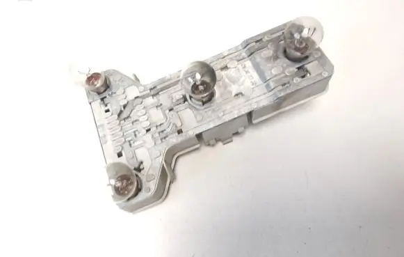 Tail light bulb cover holder