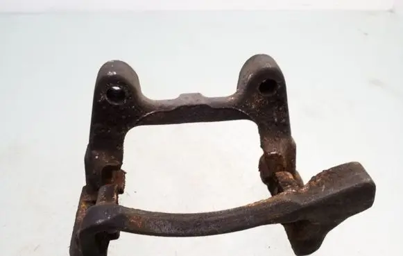 Volkswagen PASSAT B7 Brake caliper pad carrier rear 0107A