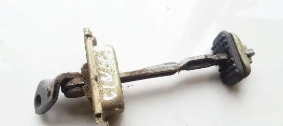 Front door check strap stopper