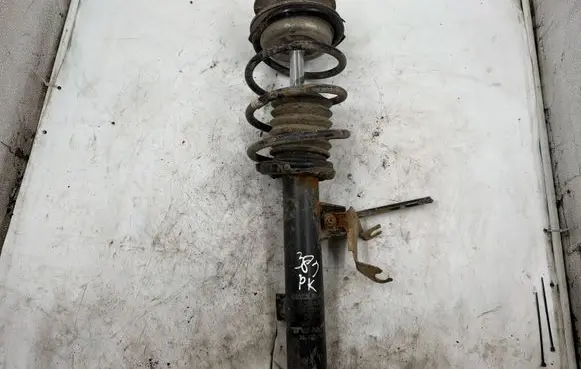 Mitsubishi Lancer X Front shock absorber with coil spring 04772112