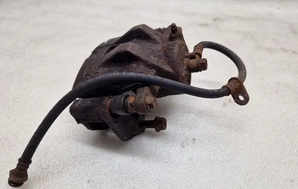 Suzuki Grand Vitara II Front brake caliper