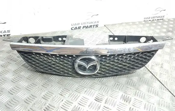 Mazda 323 Front bumper upper radiator grill B30K5071X K2443