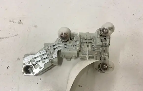 Volvo V50 Tail light bulb cover holder