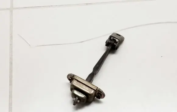 Nissan Primera Front door check strap stopper