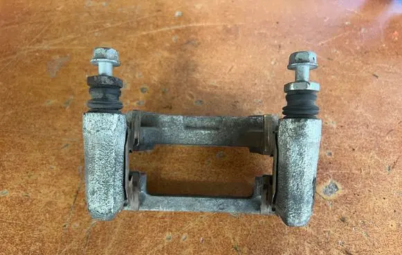 Mazda CX-3 Brake caliper pad carrier rear 