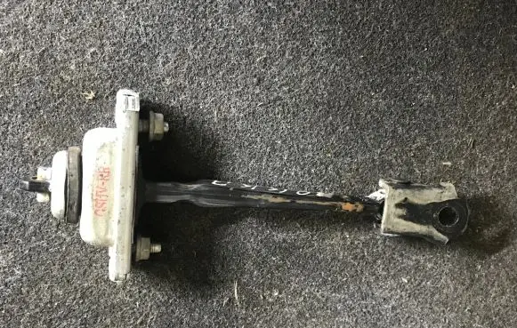 Front door check strap stopper