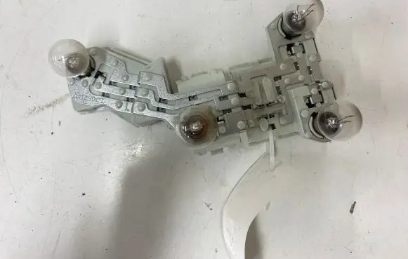 Volvo V50 Tail light bulb cover holder