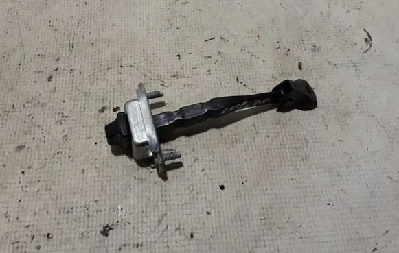 Front door check strap stopper