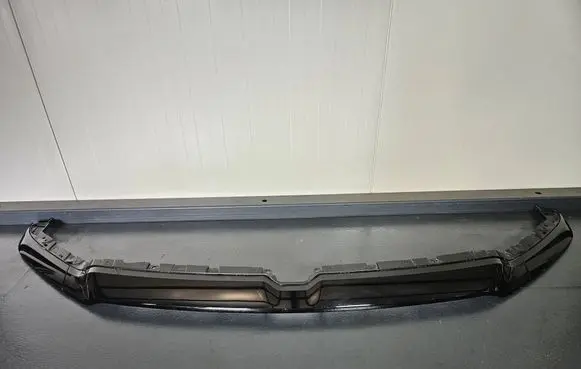 Ram 1500 DT Front bumper splitter molding 68335015AG
