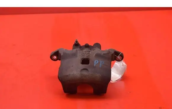 Nissan Juke I F15 Front brake caliper