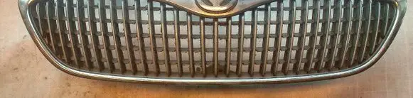 Mazda Xedos 9 Front bumper upper radiator grill T00150711