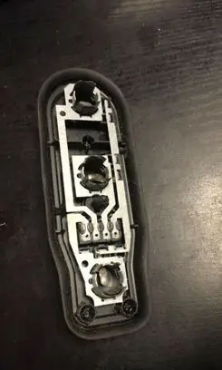 Tail light bulb cover holder