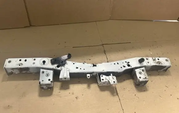 Top upper radiator support slam panel