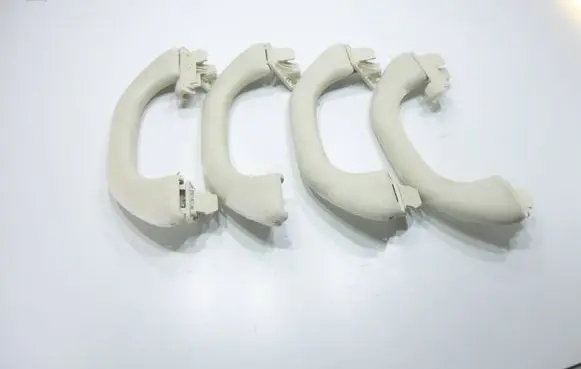 Volkswagen PASSAT B7 A set of handles for the ceiling 1K0857607M