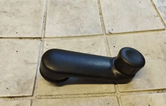 Renault Kangoo I Front door window winding handle 7700811387