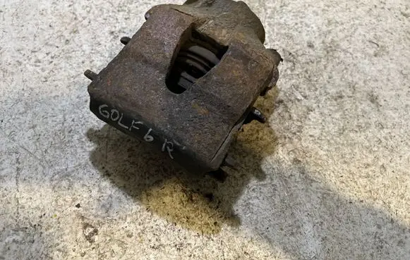 Volkswagen Golf VI Front brake caliper