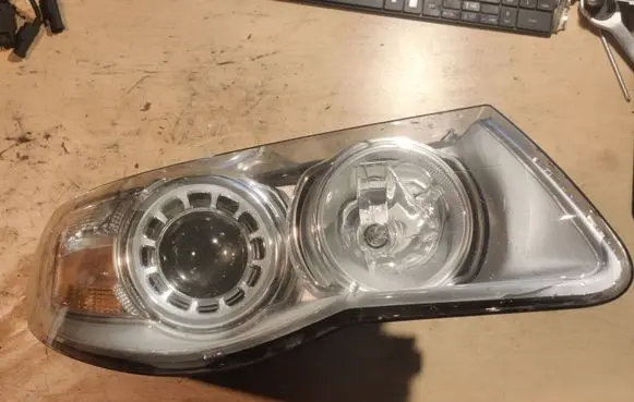 Volkswagen Touareg I Headlight/headlamp 7L6941032