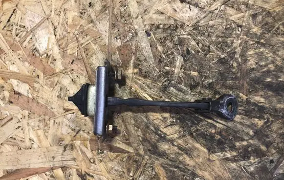 Mazda MPV Front door check strap stopper
