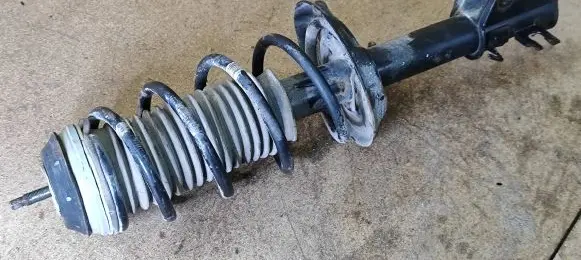 Opel Corsa D Front shock absorber with coil spring