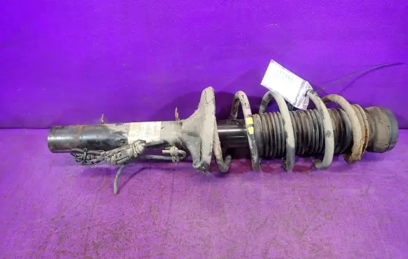 Volkswagen Golf IV Front shock absorber with coil spring 315087