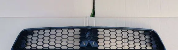 Mitsubishi Colt Front bumper upper radiator grill 7450A457 97036