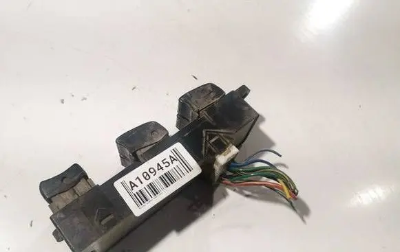 Nissan Almera Tino Front door window switch trim 