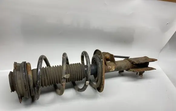 Nissan X-Trail T31 Front shock absorber with coil spring
