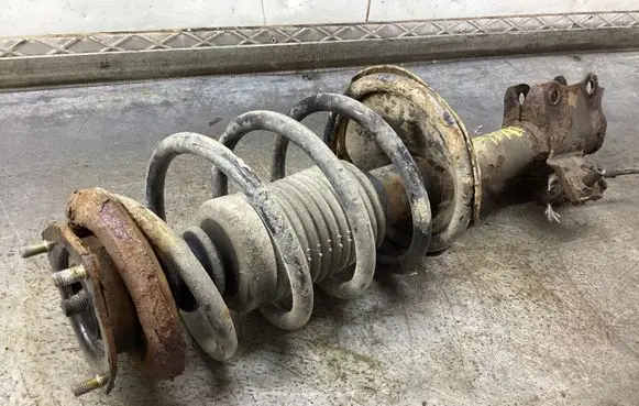 Nissan Almera N16 Front shock absorber with coil spring