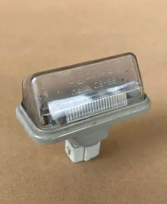 Toyota Avensis T250 Number plate light E1001479 H110555