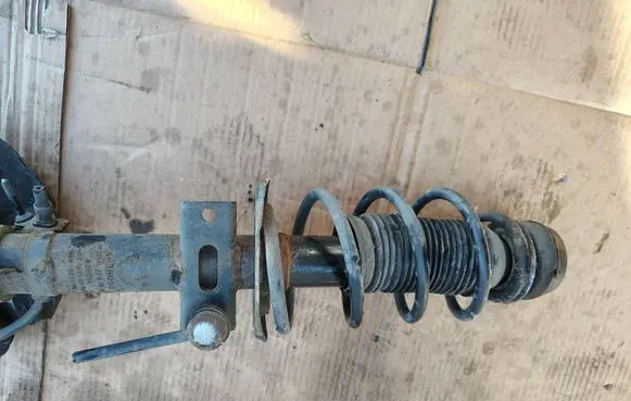 Front shock absorber with coil spring