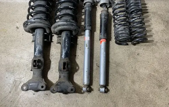 Mercedes-Benz E C207 W207 Set of springs and shock absorbers (Front and rear) 