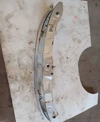 Radiator support slam panel bracket