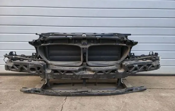 Radiator support slam panel