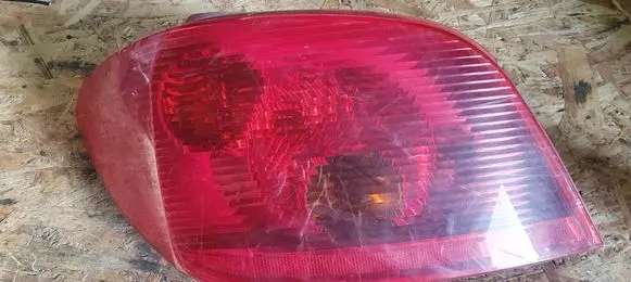 Tail light bulb cover holder