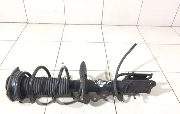Nissan Juke I F15 Front shock absorber with coil spring